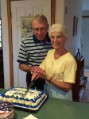 Dad and Mom cutting their Anniversary cake