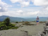 Emily emerges over the summit lip on West Baldpate