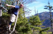 Nate hangs off the edge of the Hi Cannon Trail