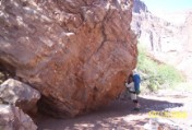 Nate moves a boulder off the trail