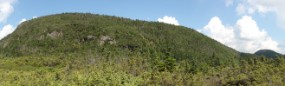 ZOOM - lunch on cliff left, wood ladder is vertical white spot near center