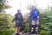 Dan and Nate all smiles on Hancock North Peak despite soaked to the bone