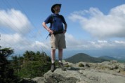 Nate on Killington summit, south view behind