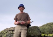 Nate munching trail mix at the summit of Little Haystack Mt