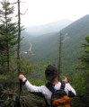 Bruce on the edge of 800 foot cliffs on The Eyebrow trail