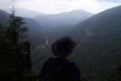 Nate on the edge of 800 foot cliffs on The Eyebrow trail