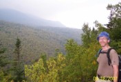 Ascending the Owls Head slide with Lincoln and Lafayette obscured by the murk