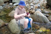 Nate treats and replenishes his water supply in Lincoln Brook