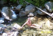 Bruce cures his 3-day grunge with a dip in frigid mountain stream water