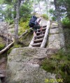 Bruce climbs a ledge ladder on the Twinway Trail