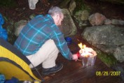 Sunday morning, Nate on our tent platform firing up the stove for breakfast