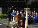 Arriving at the podium for her speech