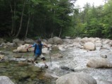 Bruce makes a stretch move trying to stay dry on another water crossing