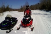 Happiness is a groomed trail, blue sky, and a fast sled